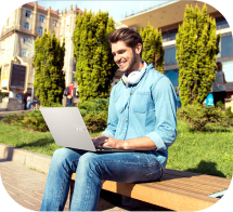 Learner working outdoors on a laptop